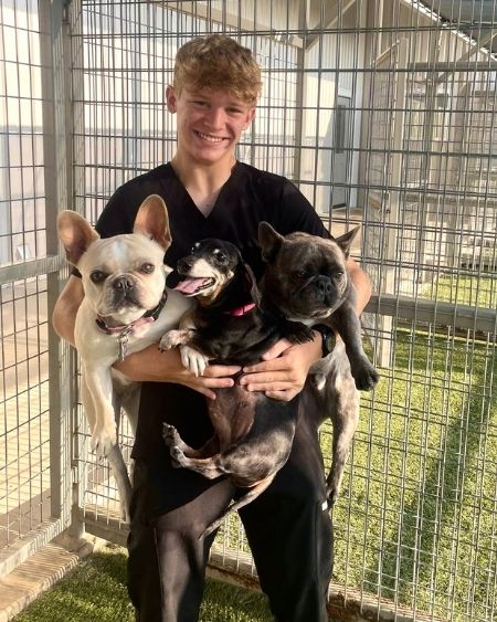 Texas West Animal Health Staff holding 3 dogs
