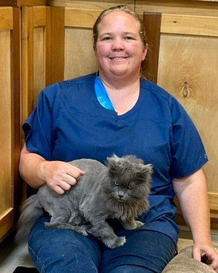 Texas West Animal Health Staff posing with a cat