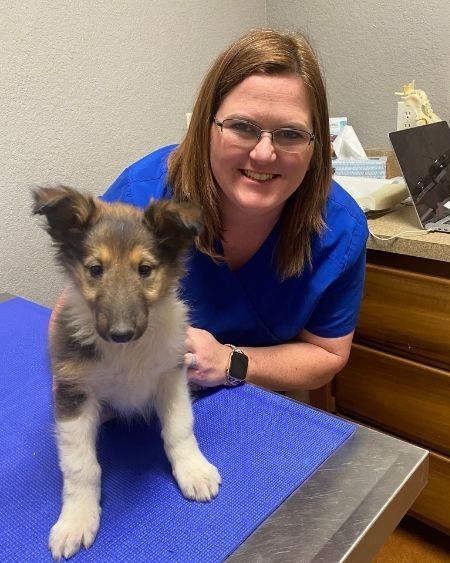 Texas West Animal Health Staff smiling with a puppy